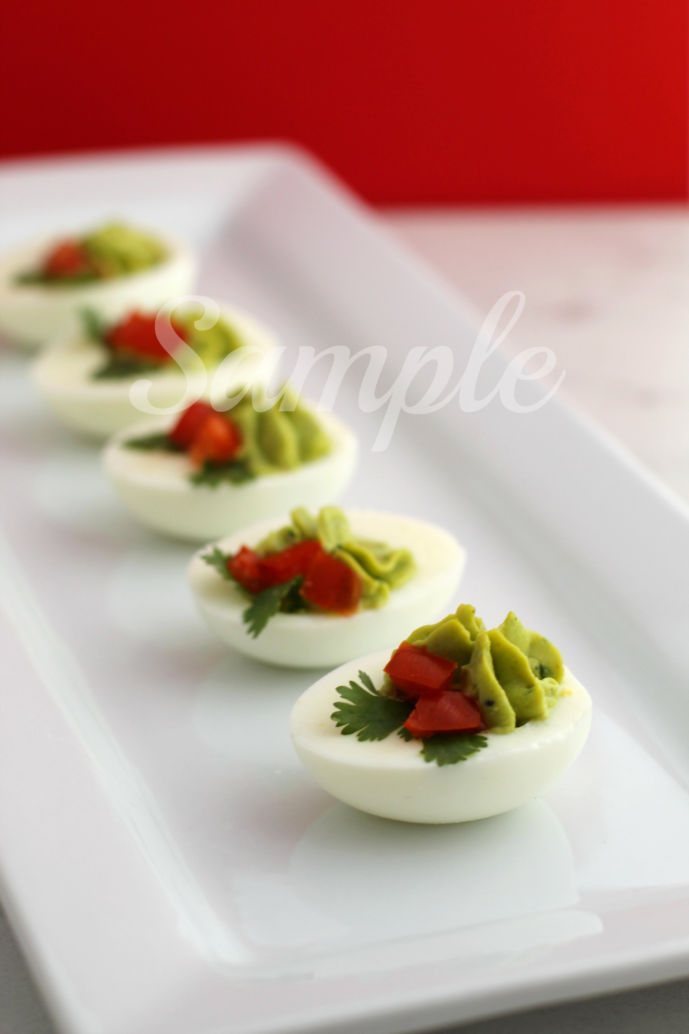 Creamy Christmas "Holly" Avocado Deviled Eggs 4